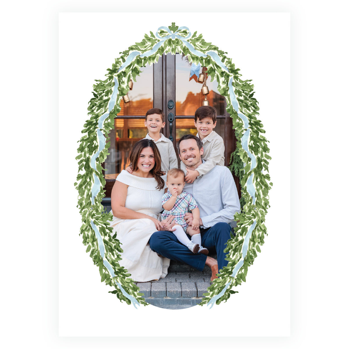 Elegant personalized Christmas photo card framed with greenery and blue ribbon