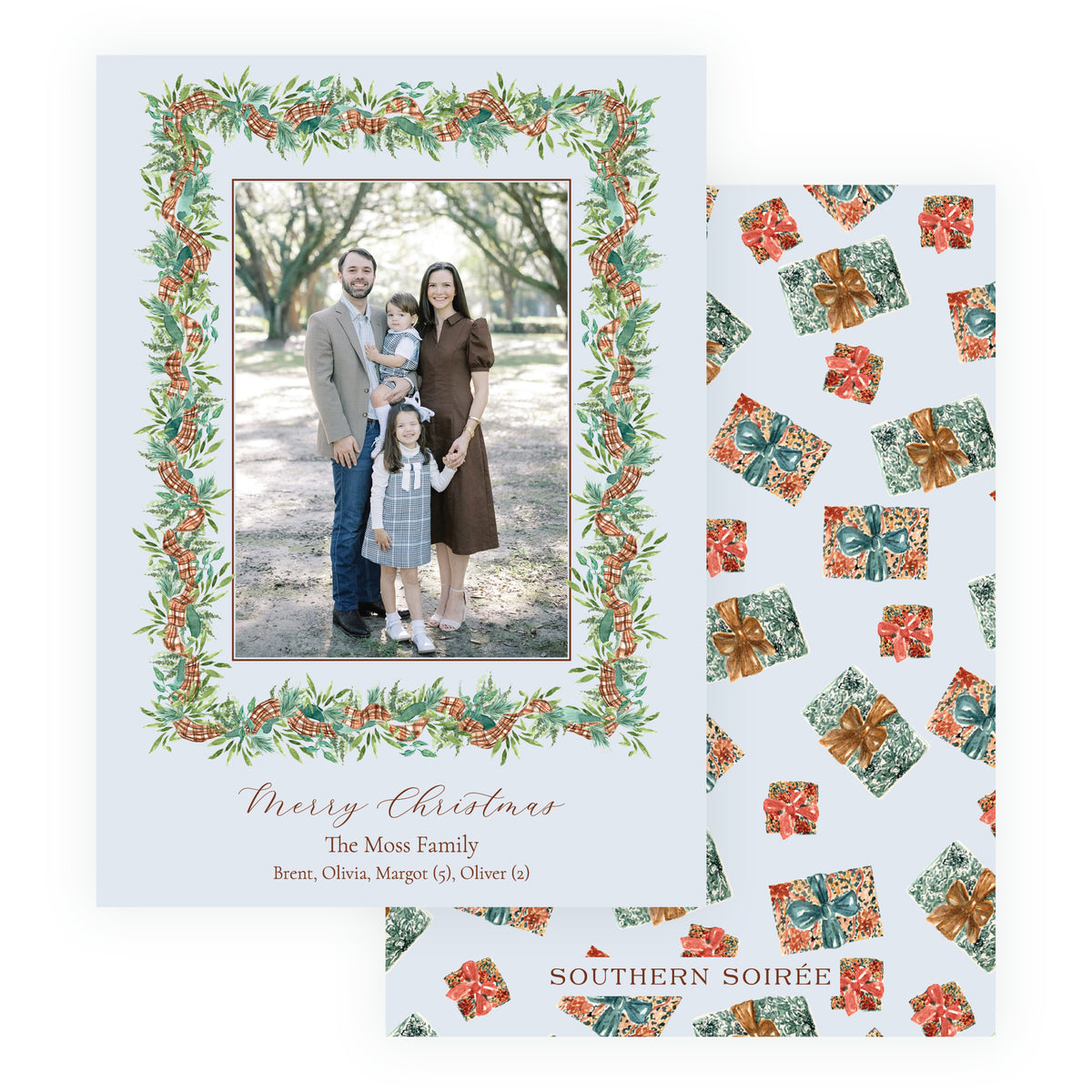 Personalized Christmas photo card with vertical family portrait surrounded by watercolor evergreen greenery, pinecones and plaid ribbon.