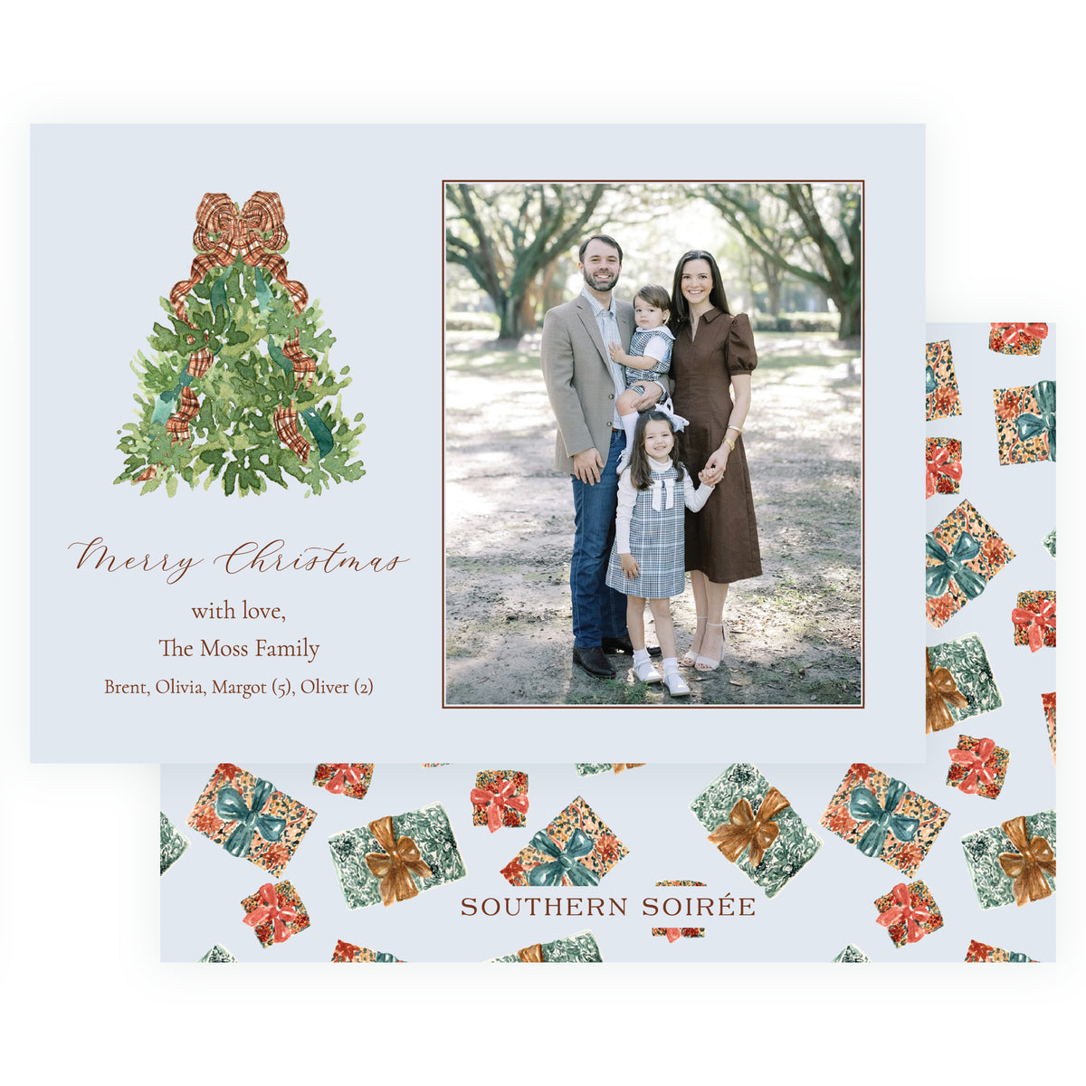 Personalized Christmas photo card with watercolor evergreen tree wrapped in plaid ribbon beside a family portrait on a soft blue background.