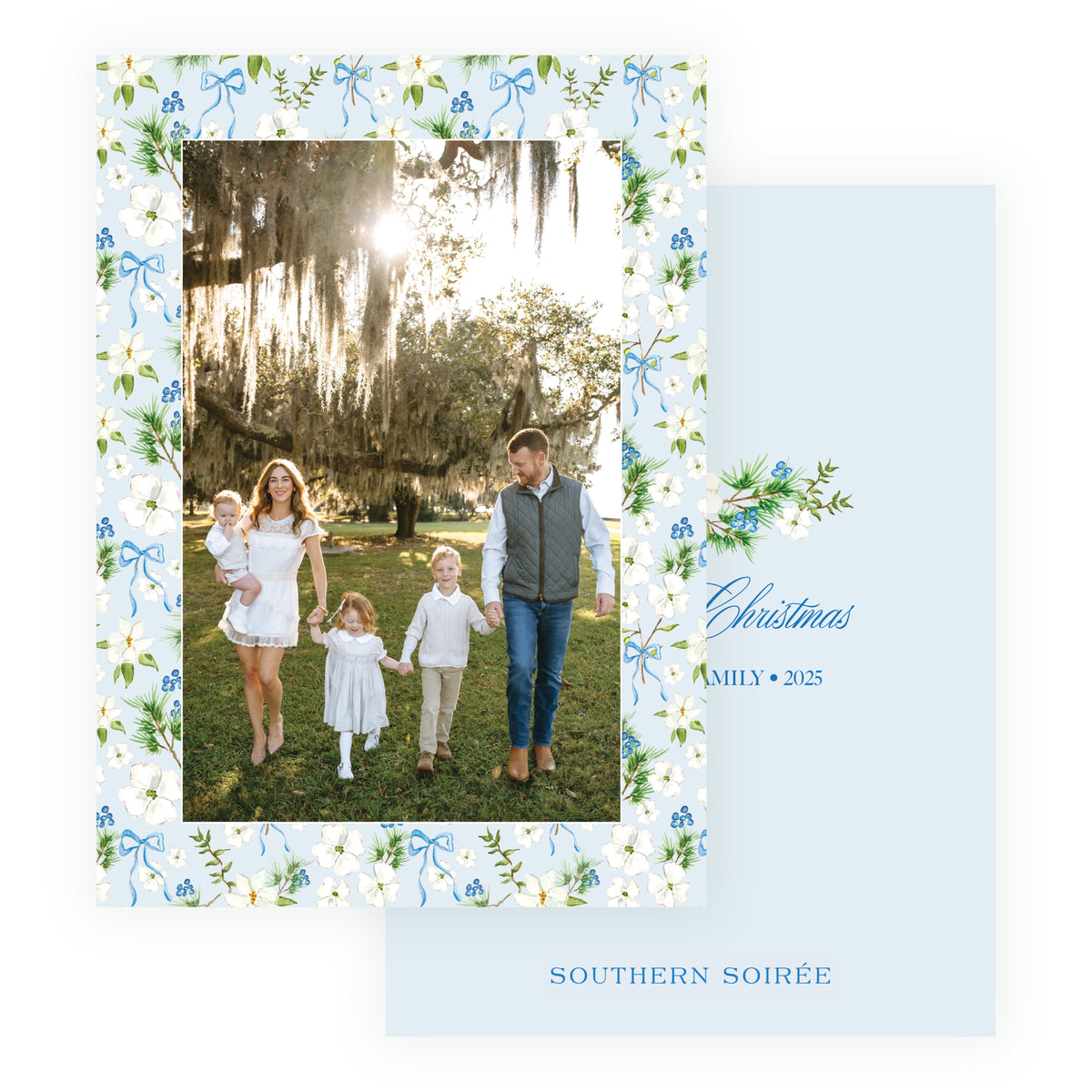 Holiday Blossom Pattern Frame personalized Christmas photo card with family photograph surrounded by white flowers, greenery, blue berries and bows.
