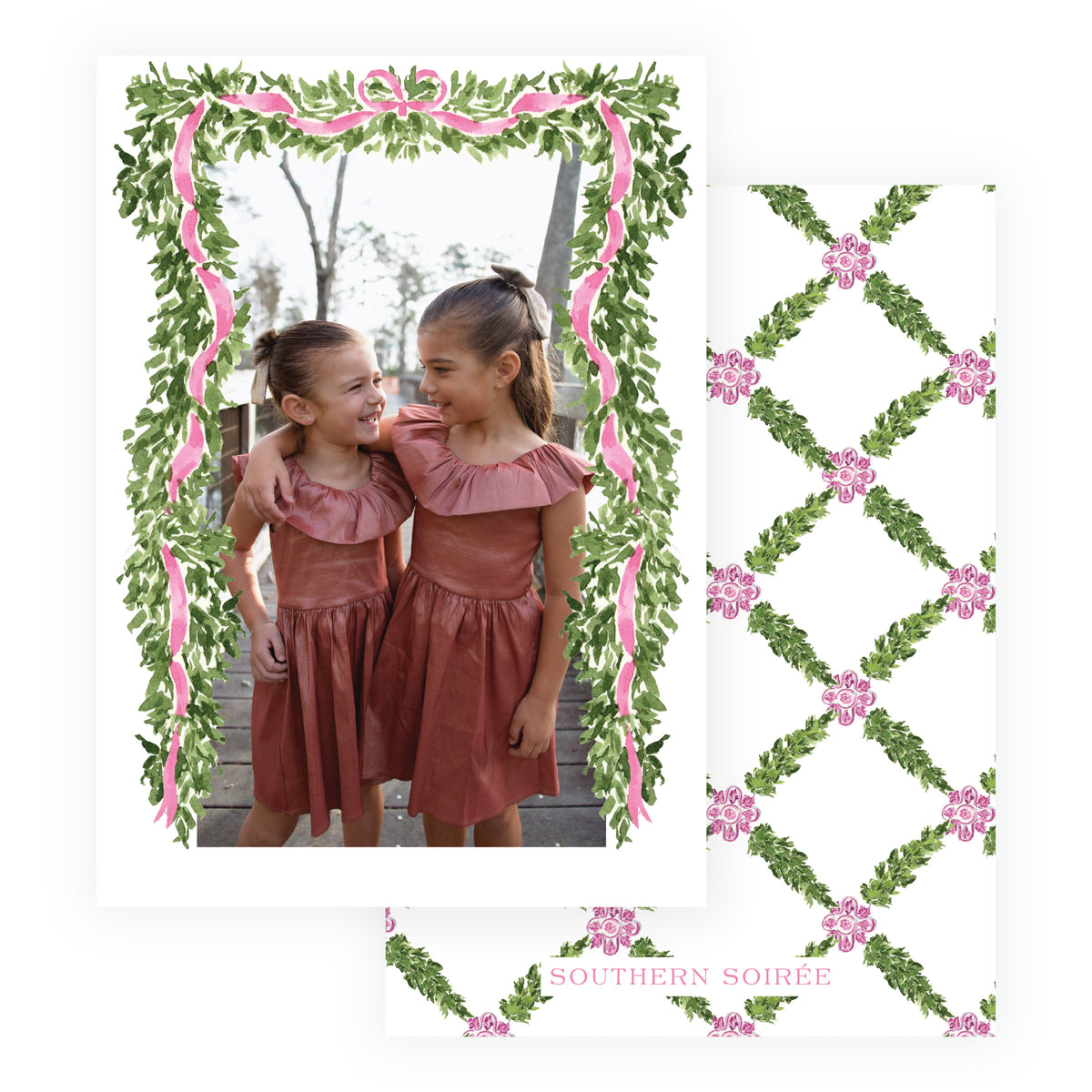 Personalized family Christmas card surrounded by greenery and pink ribbon