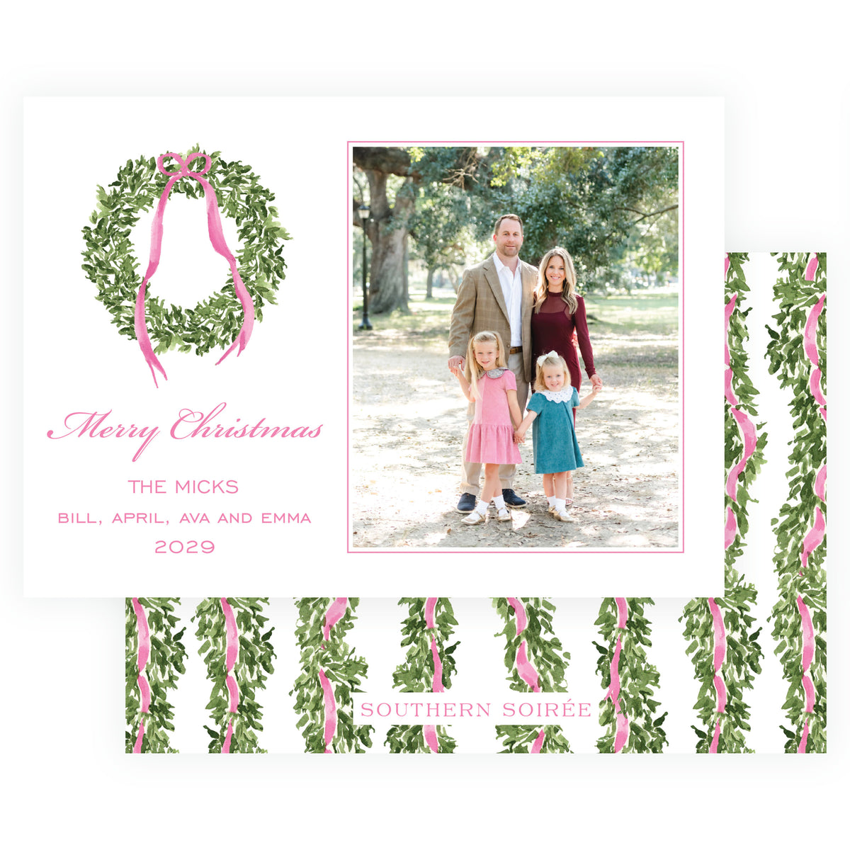 Landscape family Christmas card with evergreen wreath and pink ribbon