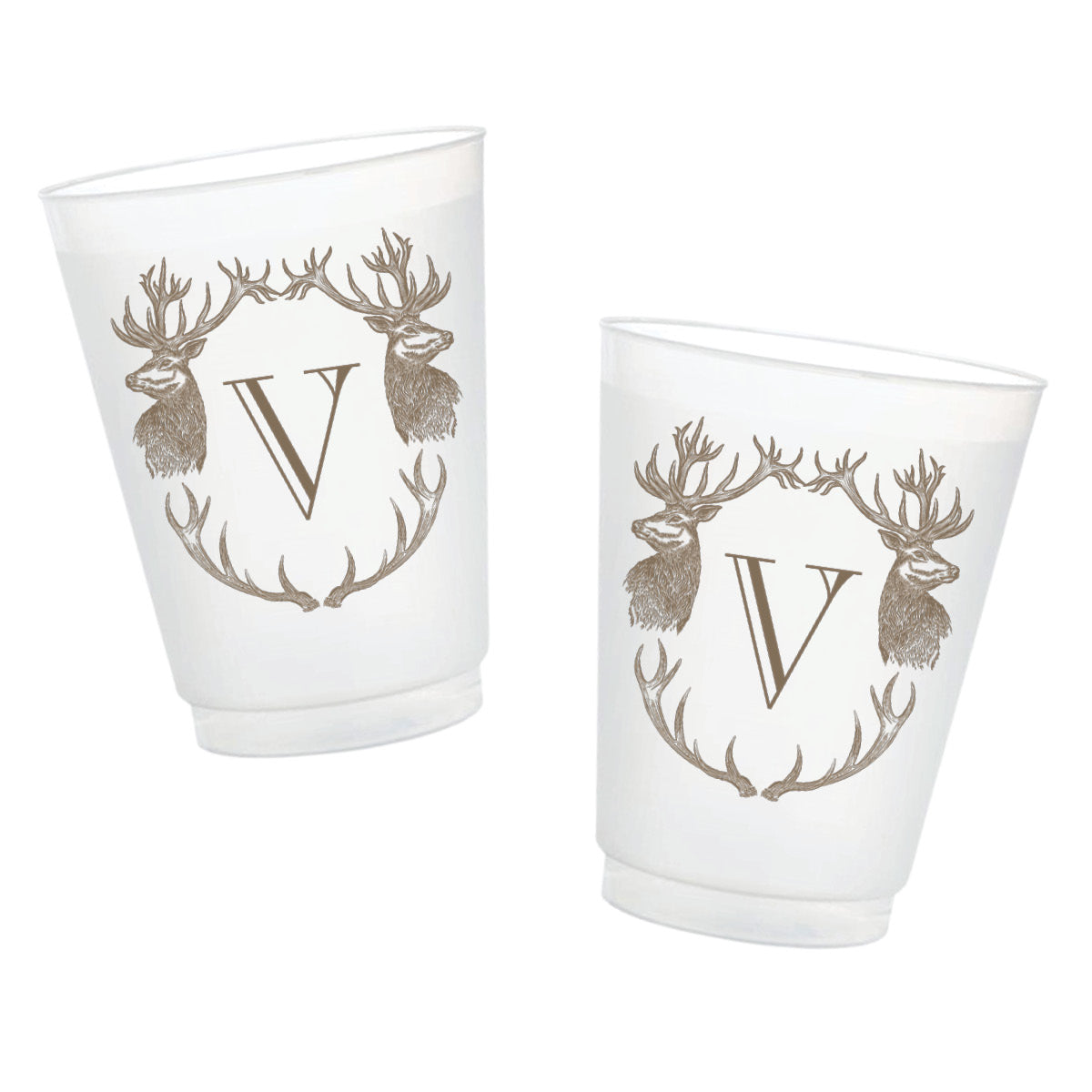 Two frosted glass tumblers with a metallic gold monogram 'V' framed by two deer heads and antlers, shown on a plain white background.