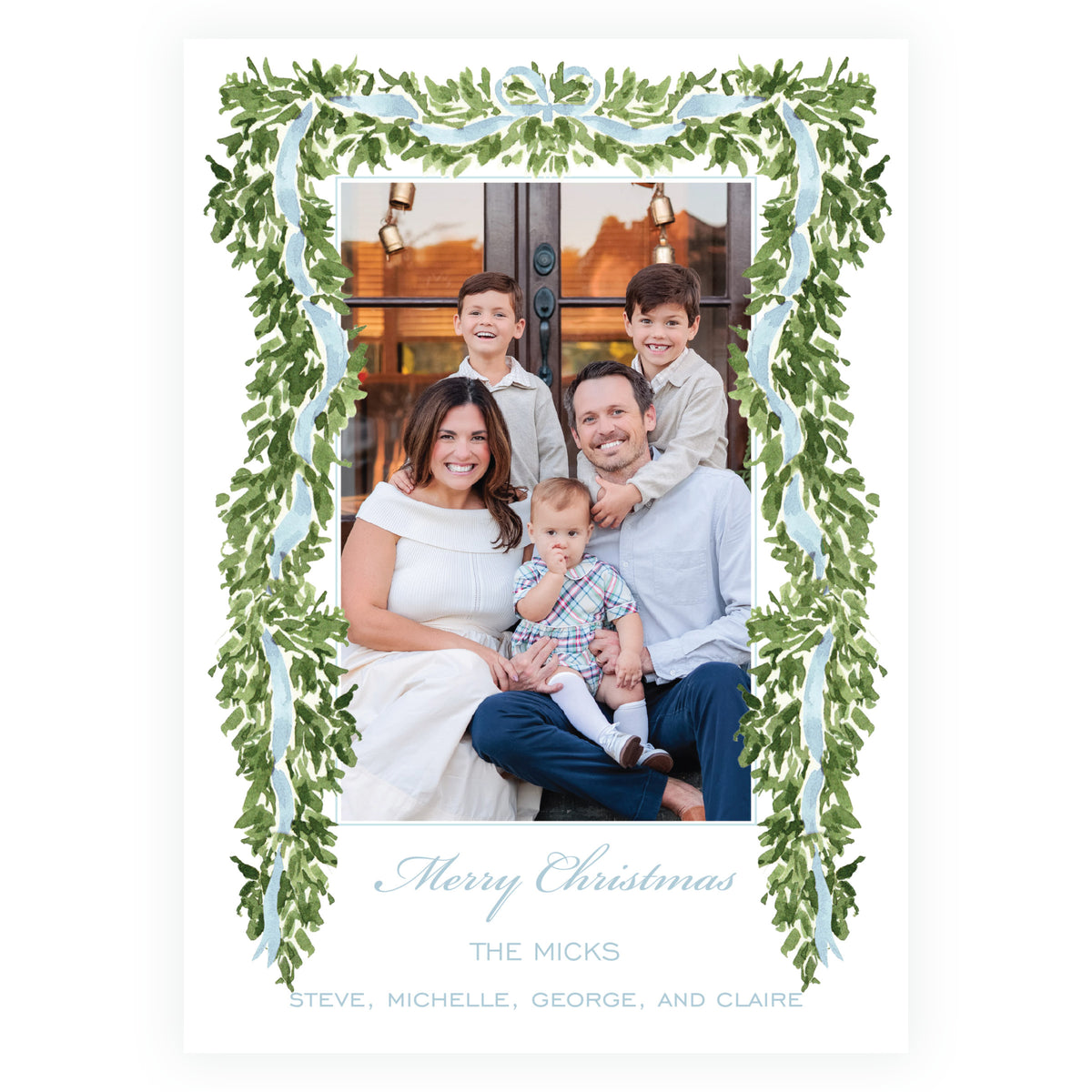 A personalized Christmas family photo card featuring a watercolor green wreath border with light blue ribbon details, surrounding a family portrait. 