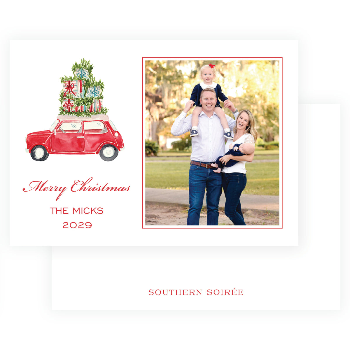 Landscape family Christmas card with evergreen wreath and red ribbon