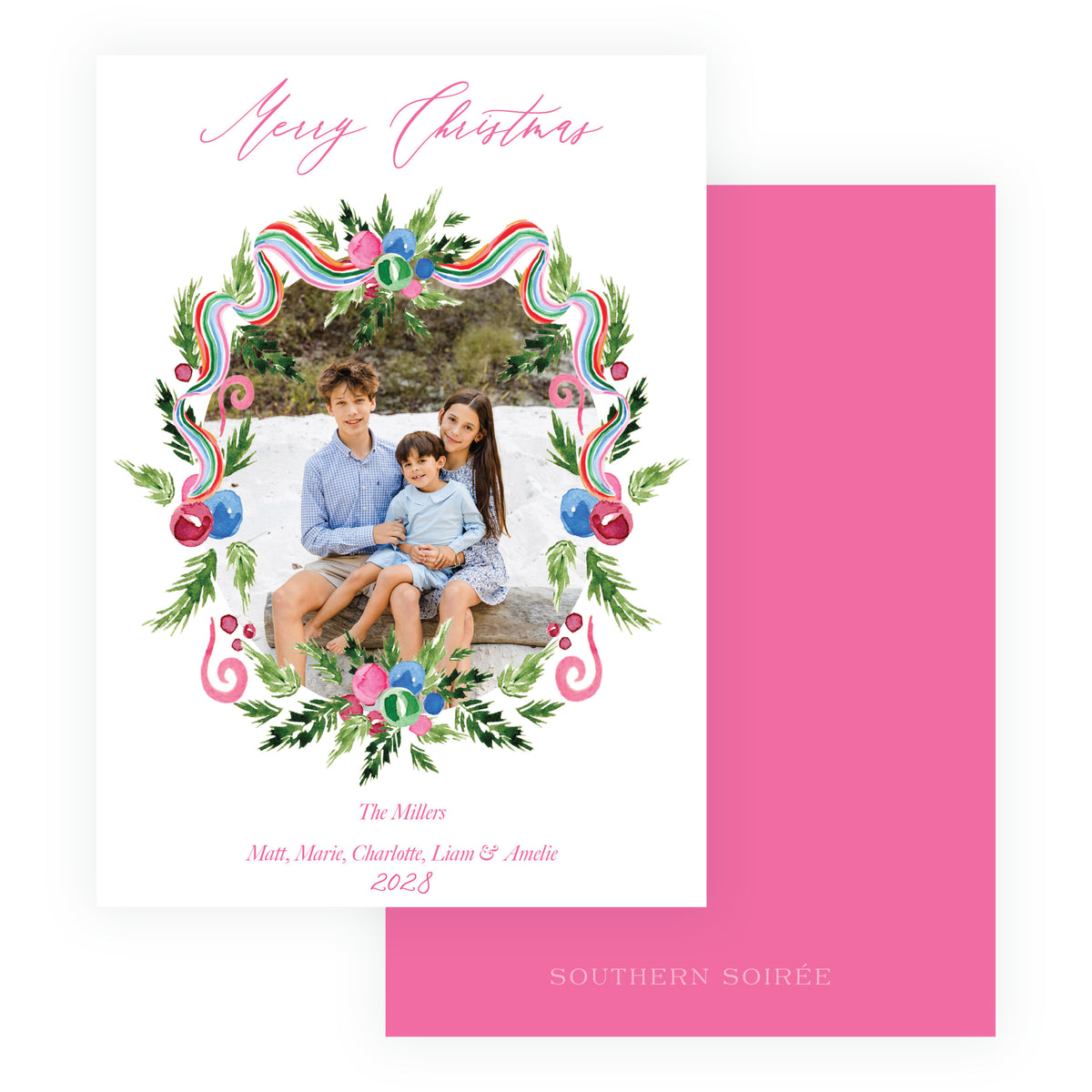 Family Christmas card framed with watercolor greenery and festive ribbon