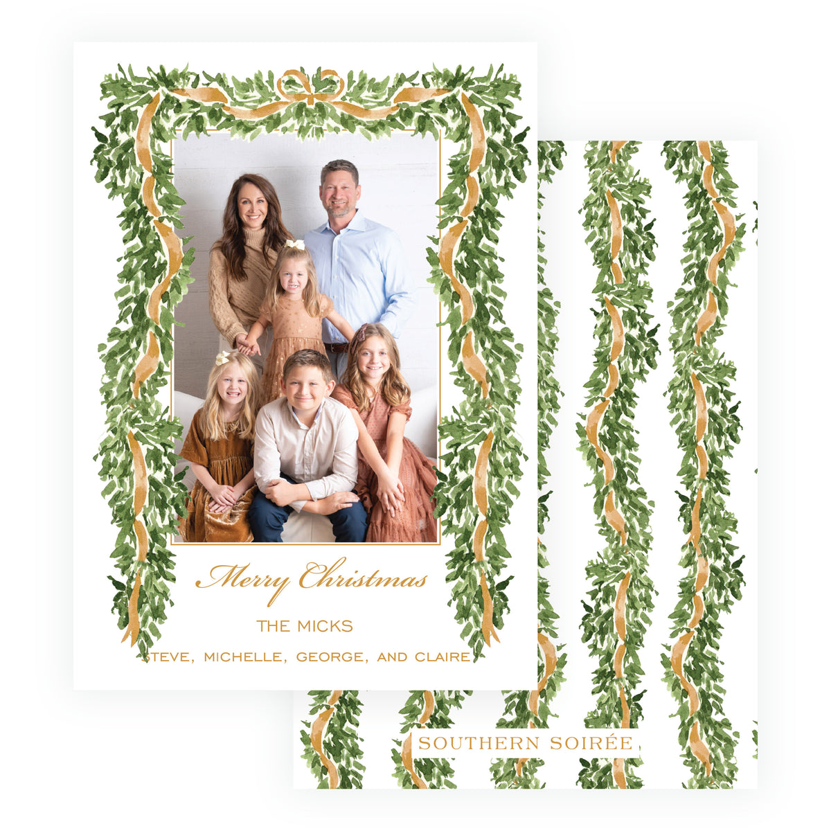 Personalized family Christmas photo card surrounded by greenery and gold ribbon