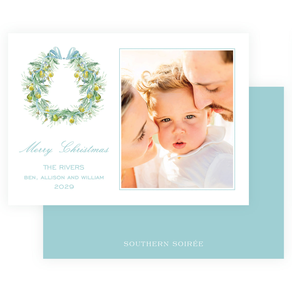 A square Christmas greeting card with a white border, featuring a watercolor wreath with green leaves and yellow ornaments, teal script text reading 'Merry Christmas,' and a custom photo