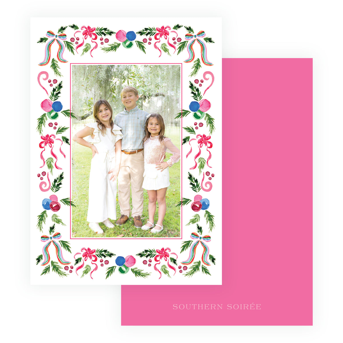 Family Christmas photo card framed with colorful bows ornaments and greenery