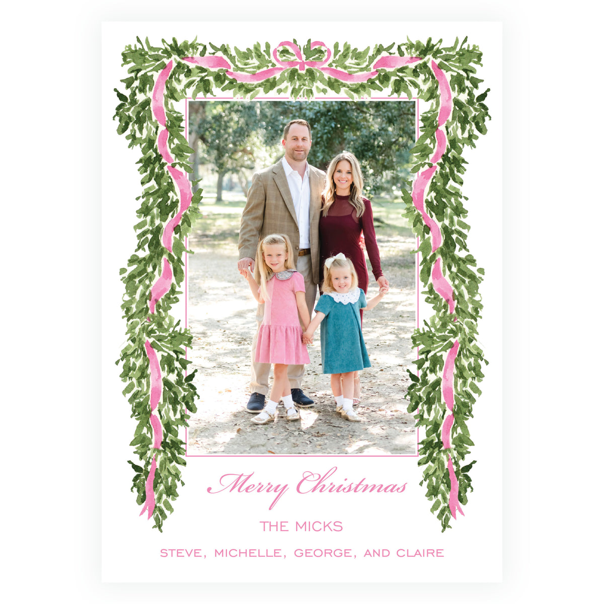 Personalized holiday photo card framed with evergreen garland and pink bow