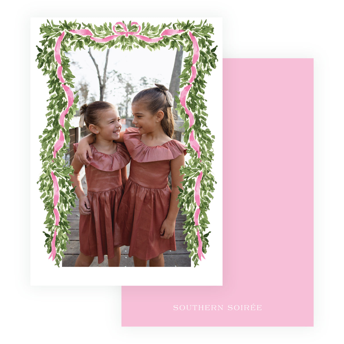 Pink full frame personalized Christmas photo card with evergreen garland