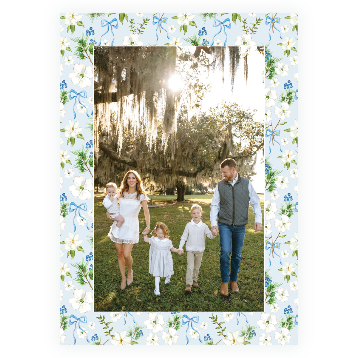 Holiday Blossom Pattern Frame personalized Christmas photo card with family photograph surrounded by white flowers, greenery, blue berries and bows.