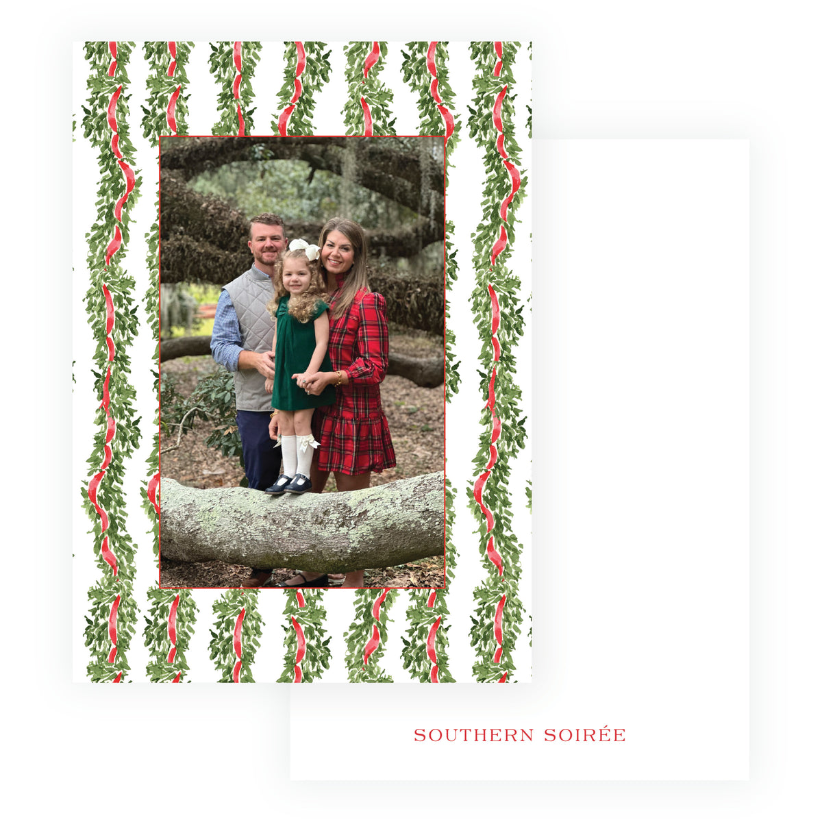 Personalized Christmas photo card with repeating evergreen garland and red ribbon