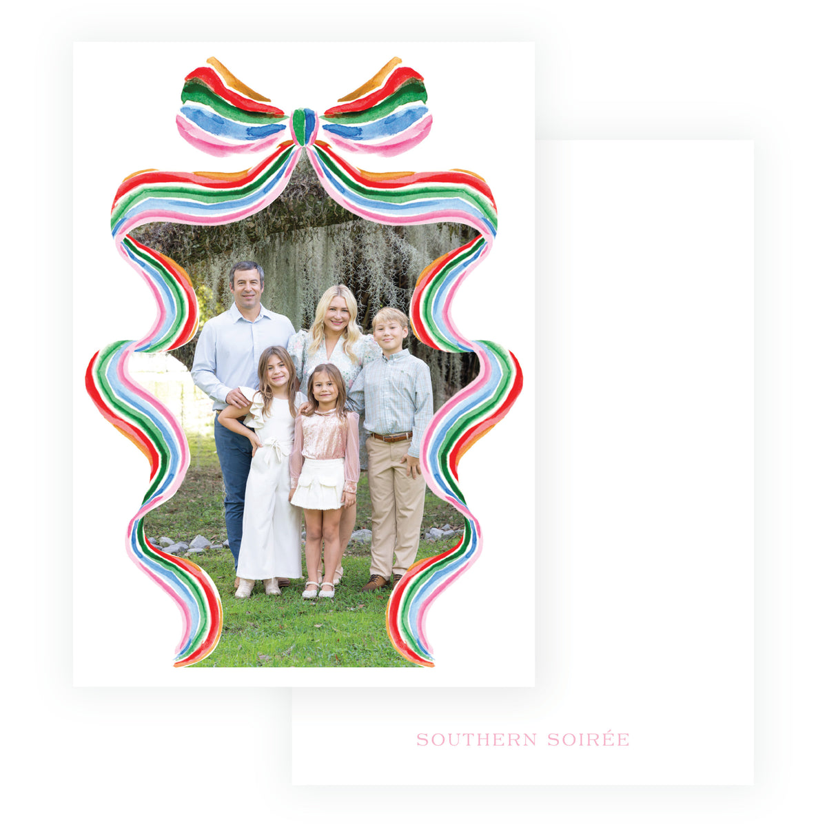 A white holiday ornament-shaped greeting card featuring a colorful rainbow-striped bow at the top and a photo cutout of a family